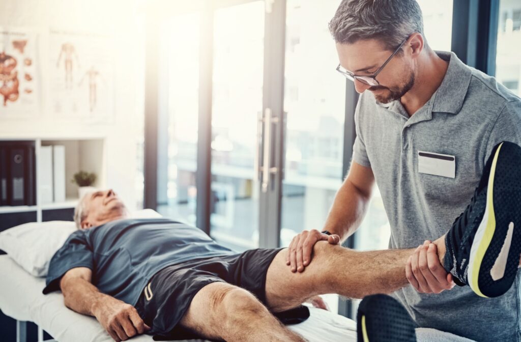 An adult gets a manual adjustment from their physical therapist.